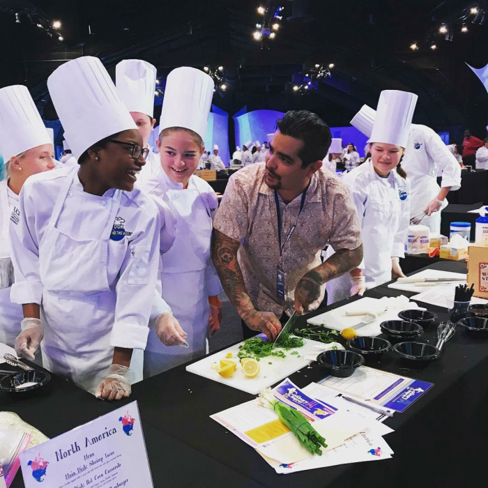 Aaron Sanchez with Student at Cook Around The World